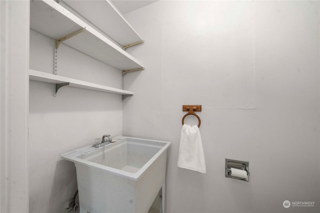 clothes washing area featuring sink and hookup for a washing machine