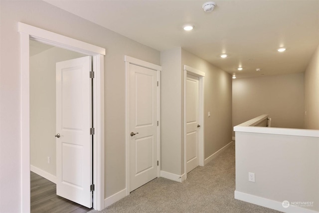 hallway featuring carpet