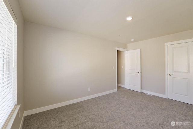 unfurnished bedroom featuring carpet flooring