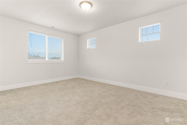 unfurnished room featuring carpet floors