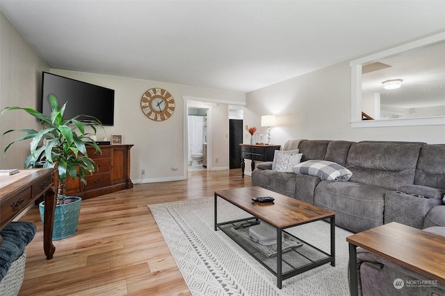 living room with light hardwood / wood-style flooring