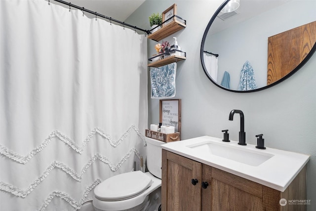 bathroom with toilet and vanity