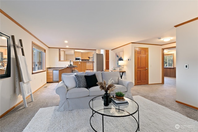 living room with ornamental molding and light carpet