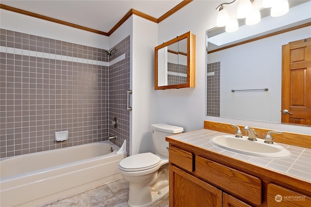 full bathroom with toilet, crown molding, tiled shower / bath, vanity, and tile patterned flooring