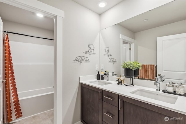 bathroom featuring vanity, tile patterned flooring, and shower / bath combo with shower curtain