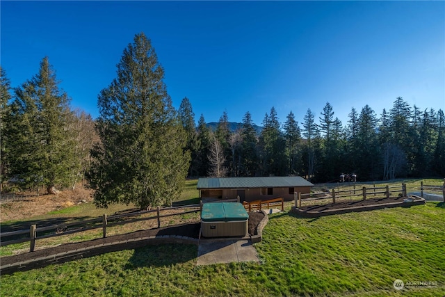 exterior space with a rural view and a lawn