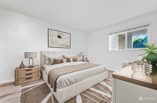 bedroom with hardwood / wood-style floors