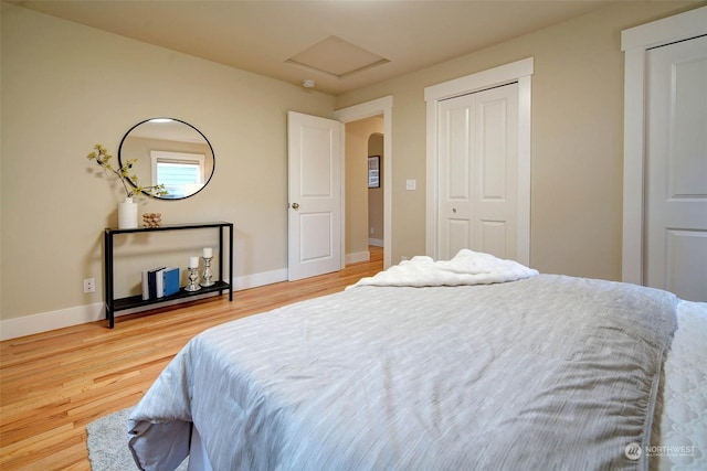 bedroom with hardwood / wood-style flooring