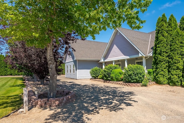 view of side of property featuring a yard