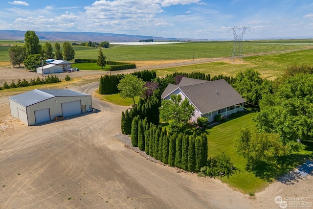 drone / aerial view with a mountain view and a rural view