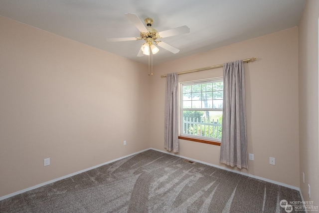 empty room with carpet flooring and ceiling fan