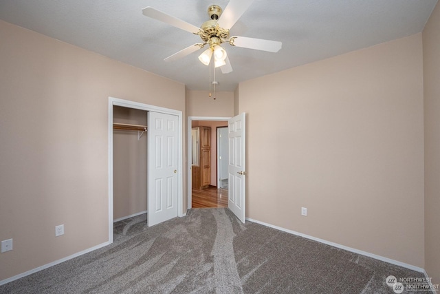 unfurnished bedroom featuring carpet flooring, ceiling fan, and a closet