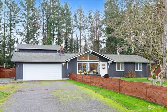 single story home featuring a garage