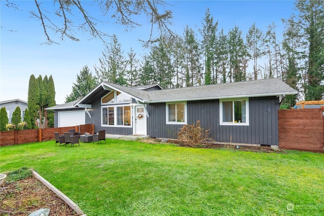 ranch-style home featuring a front lawn and a garage