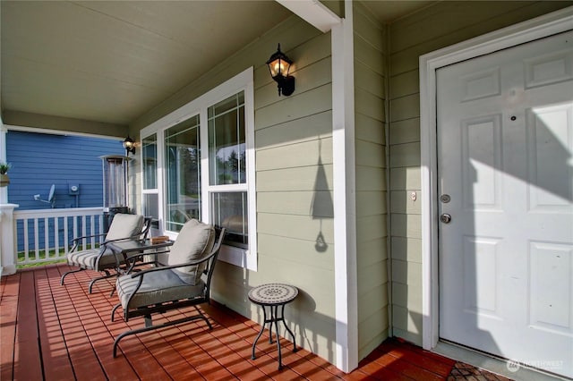 wooden terrace with a porch