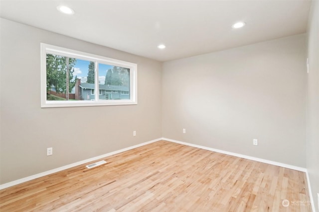 unfurnished room featuring light hardwood / wood-style flooring