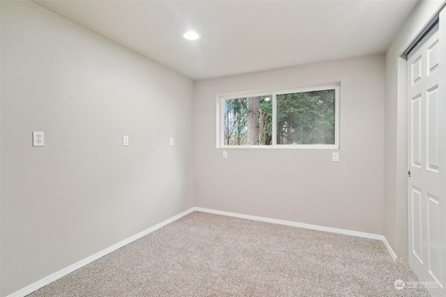 unfurnished bedroom with a closet and carpet