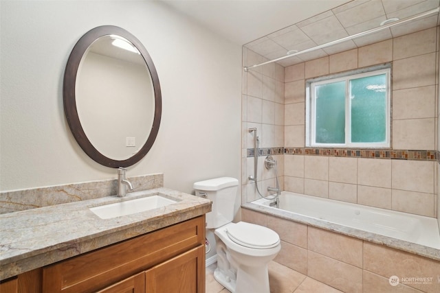 full bathroom with tile patterned floors, toilet, vanity, and tiled shower / bath