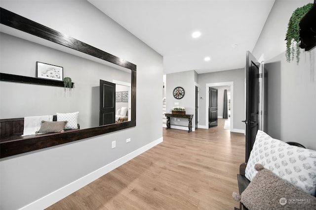 hall with light hardwood / wood-style flooring