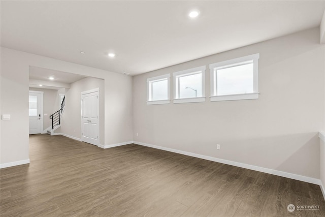 spare room with hardwood / wood-style floors