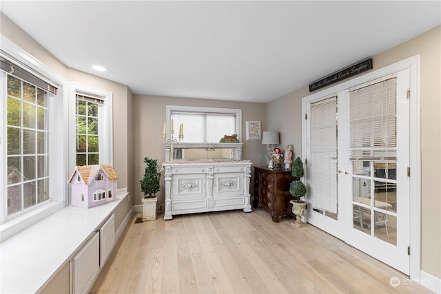 interior space with light wood-type flooring and baseboards