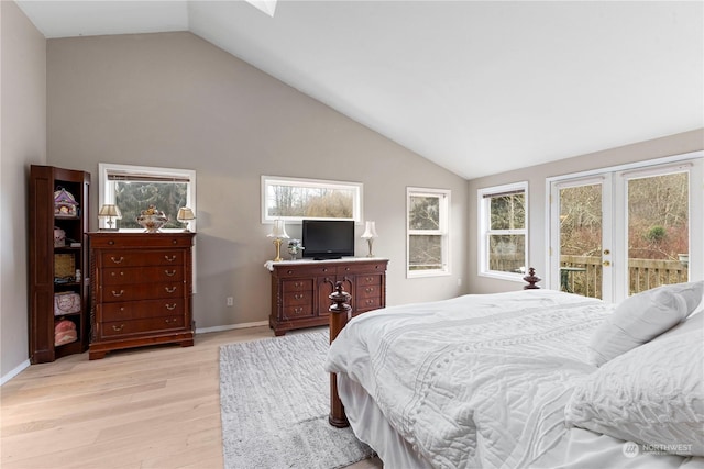 bedroom featuring access to outside, french doors, vaulted ceiling, light wood-type flooring, and baseboards