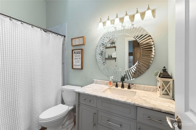 bathroom with toilet and vanity