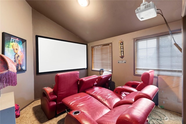 cinema room featuring vaulted ceiling and carpet flooring