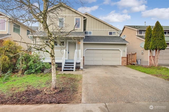 view of front of house featuring covered porch and a garage