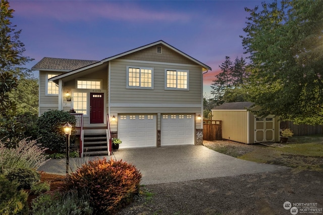 view of front of property featuring a garage and a storage shed