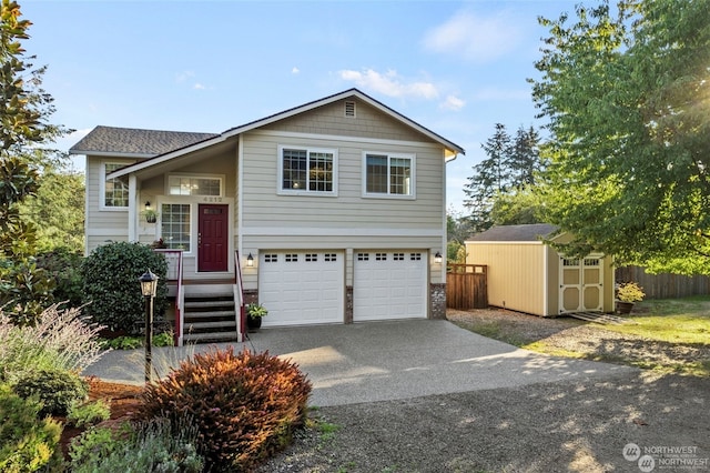 view of front of house with a storage shed and a garage