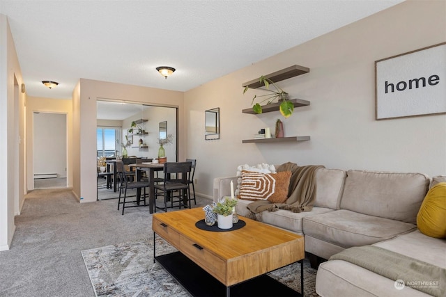 carpeted living room featuring a textured ceiling and a baseboard heating unit