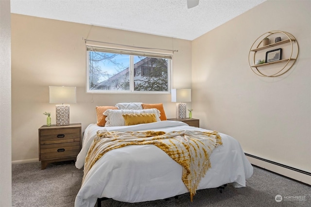 bedroom with ceiling fan, carpet floors, a textured ceiling, and a baseboard heating unit