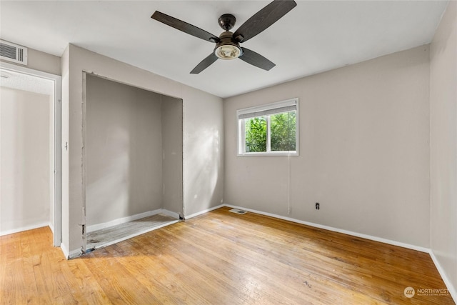 unfurnished bedroom with ceiling fan and light hardwood / wood-style floors