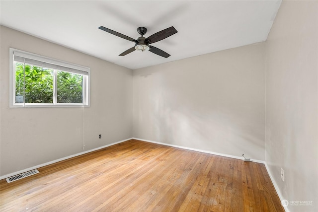 spare room with light hardwood / wood-style floors and ceiling fan