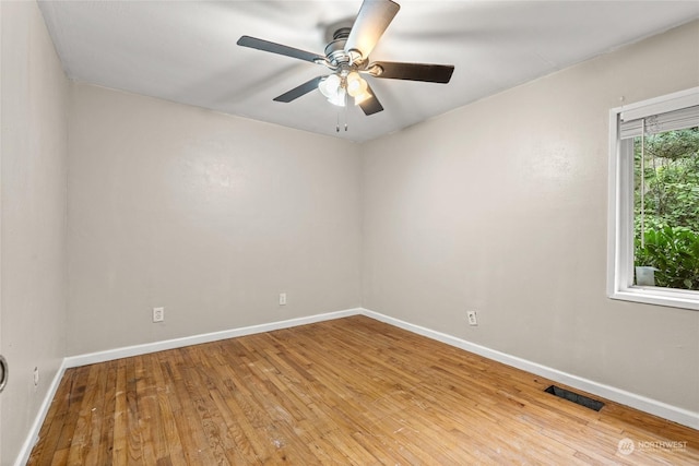 unfurnished room featuring ceiling fan and light wood-type flooring