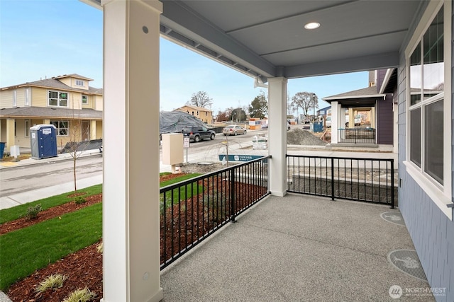 balcony with a residential view and covered porch