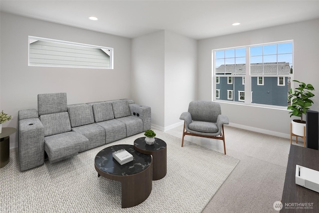 carpeted living area featuring recessed lighting and baseboards