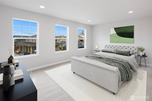 carpeted bedroom with recessed lighting and baseboards