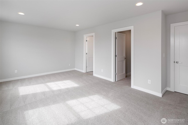 unfurnished bedroom with recessed lighting, baseboards, and carpet floors