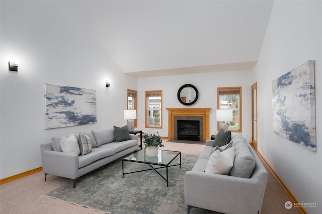 living room with high vaulted ceiling and light carpet