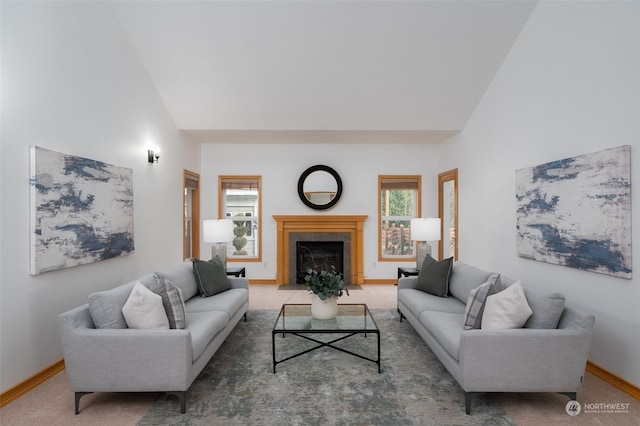 carpeted living room featuring high vaulted ceiling and a healthy amount of sunlight