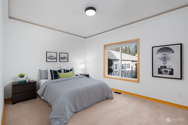 carpeted bedroom with ornamental molding