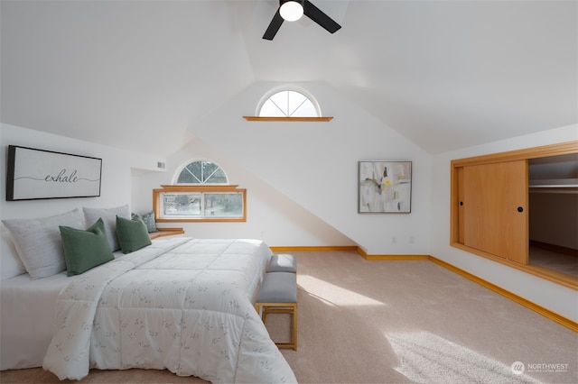 bedroom featuring vaulted ceiling, ceiling fan, and carpet