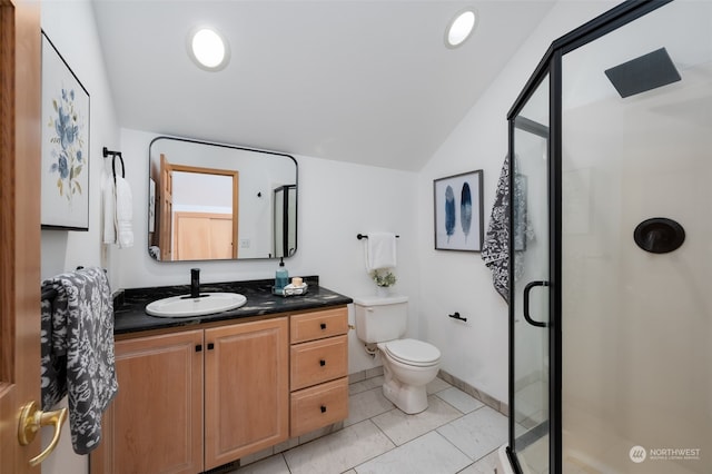 bathroom with vaulted ceiling, toilet, tile patterned floors, vanity, and a shower with door