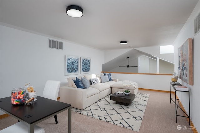 carpeted living room featuring ceiling fan