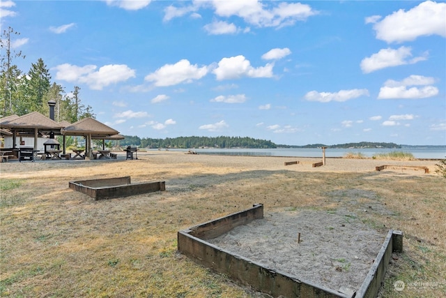 view of home's community featuring a gazebo and a water view