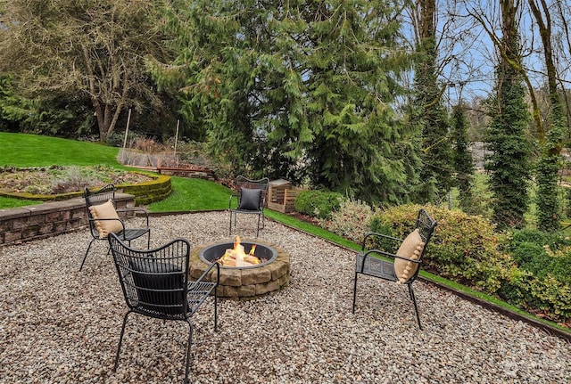 view of patio / terrace with an outdoor fire pit