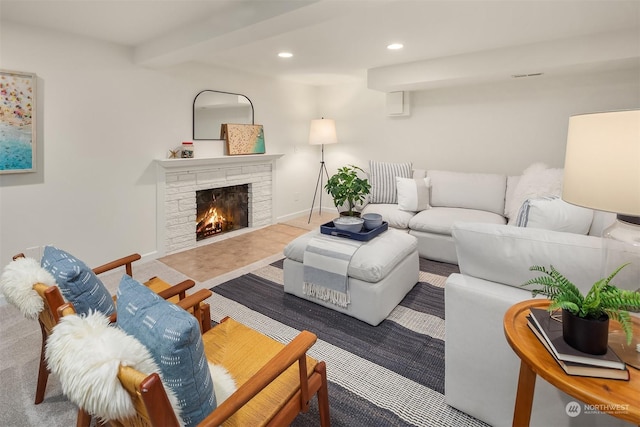 living room featuring a fireplace and beamed ceiling