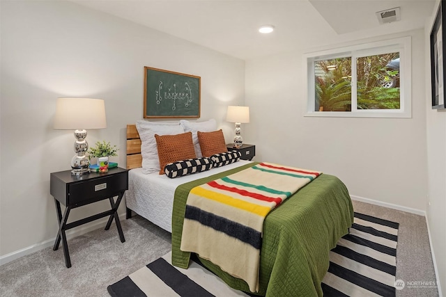 bedroom with light colored carpet